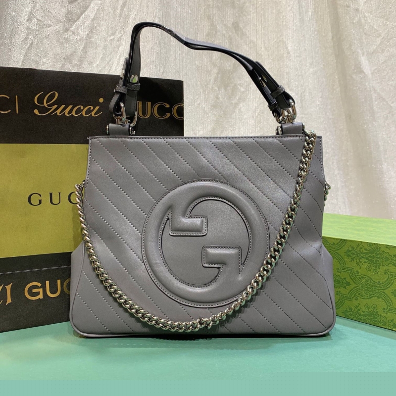 G*u*i shopping bags